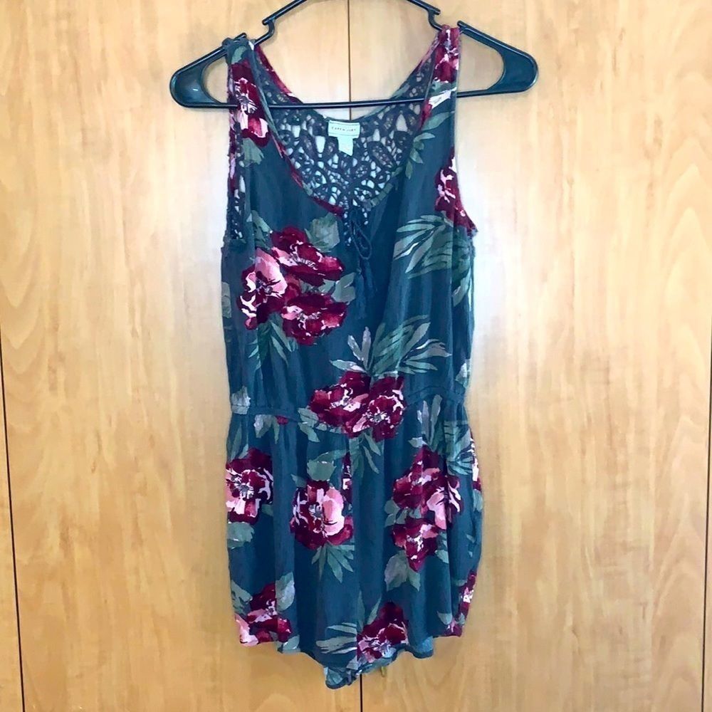 Cape Juby Floral Romper shorts. Lace back with elastic at waist. Grey with pink